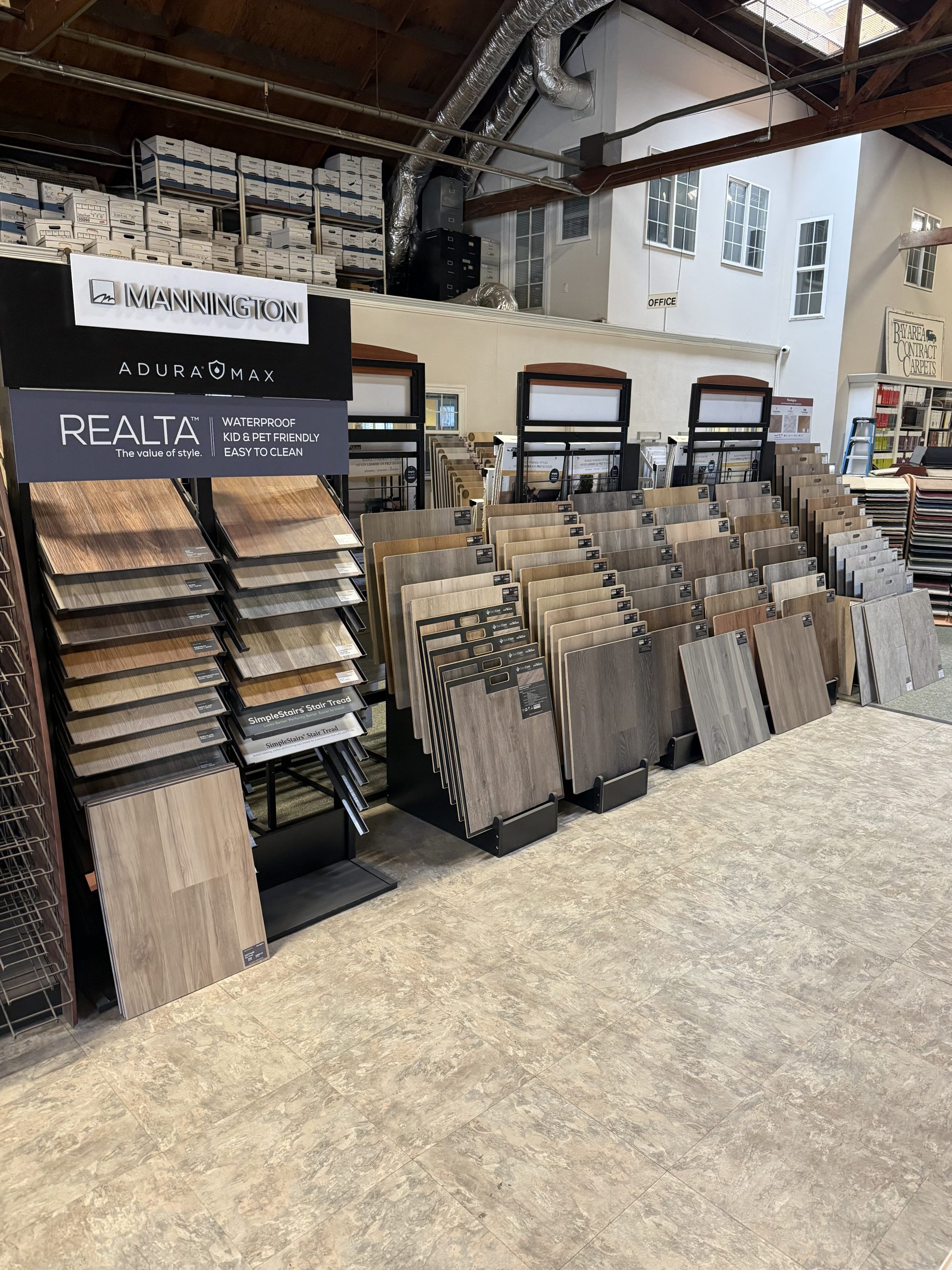 LVP and vinyl flooring samples on the Bay Area Contract Carpets showroom floor in Oakland